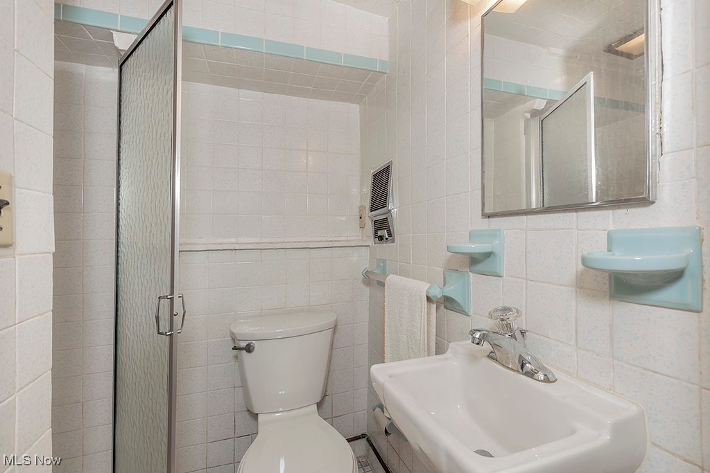 14711 South Woodland Road Cleveland, OH 44120 - Photo 26 of 31 At the Bottom of the Lower-Level Stairway is a Convenient Full Bathroom with a Stall Shower.