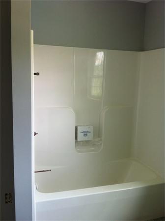 109 Chestnut Road Tyngsborough, MA 01879 - Photo 10 of 28 a bathroom with a bathtub