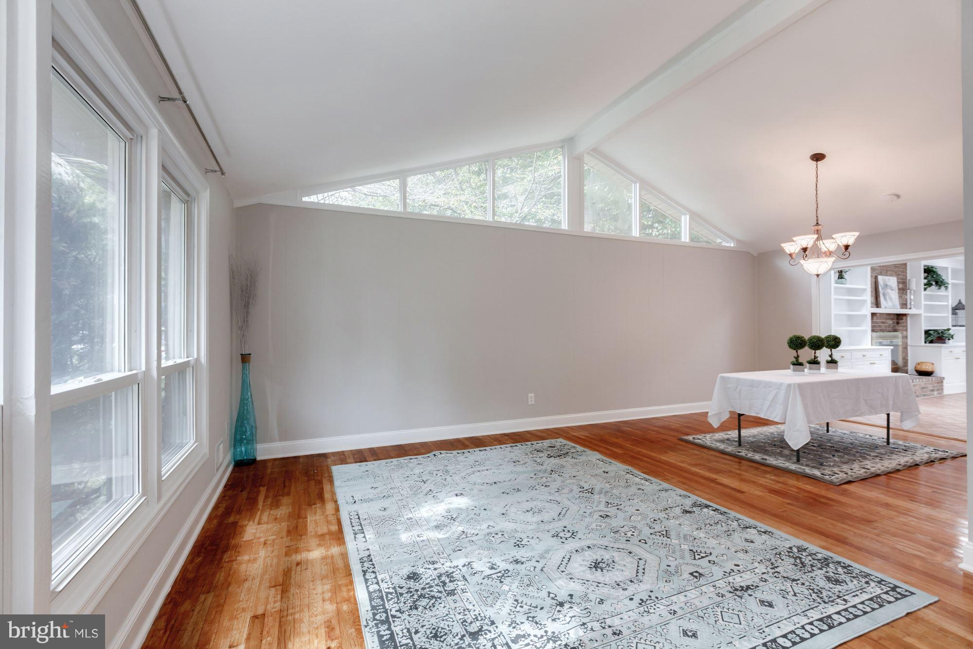 8425 Thames Street Springfield, VA 22151 - Photo 1 of 30 a view of a room with wooden floor and windows
