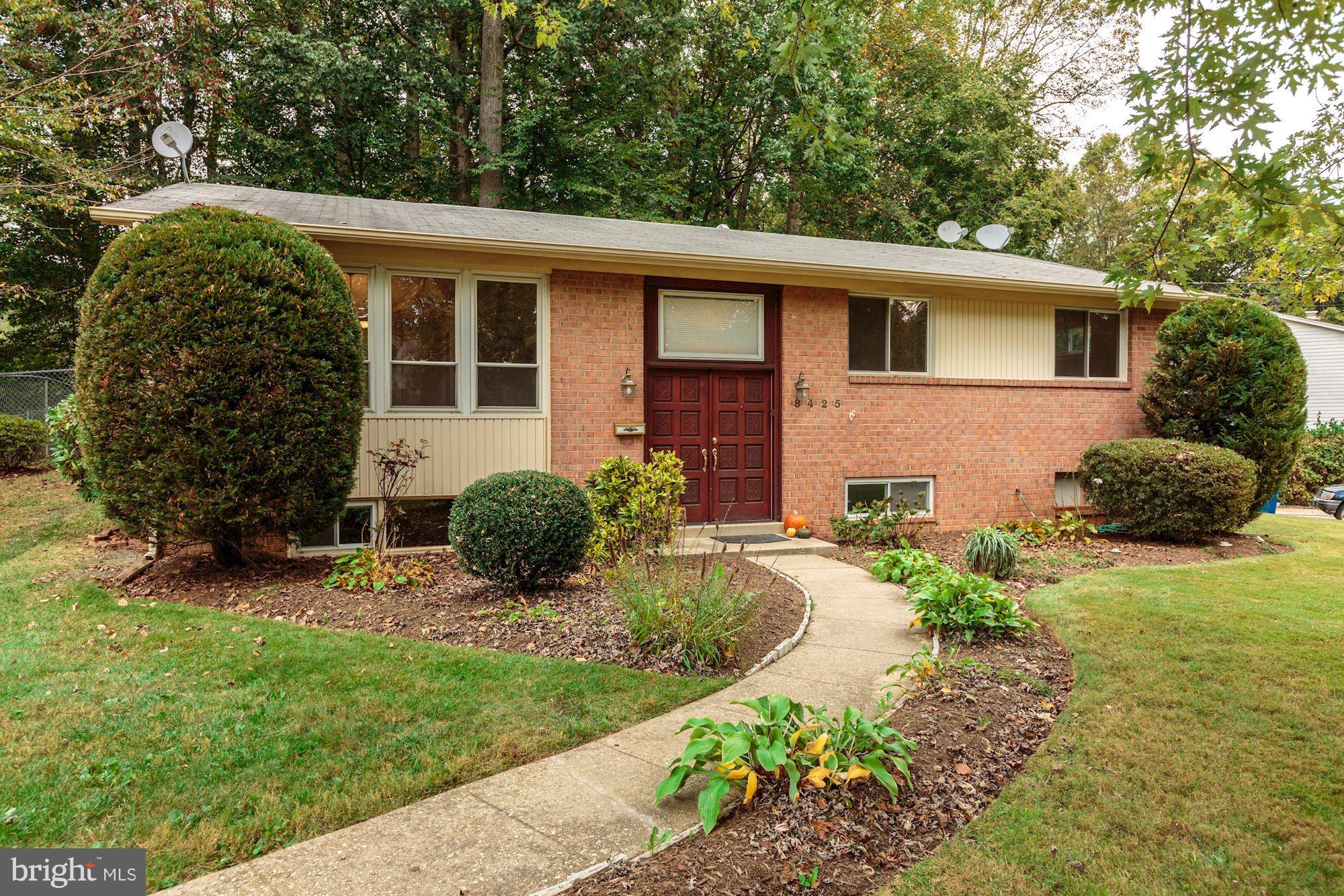 8425 Thames Street Springfield, VA 22151 - Photo 2 of 30 a front view of a house with garden
