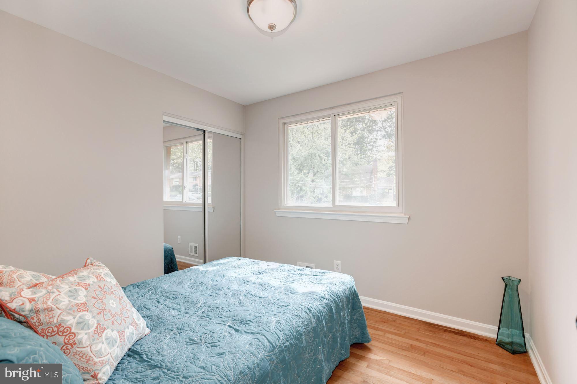 8425 Thames Street Springfield, VA 22151 - Photo 13 of 30 a bedroom with a bed and a window