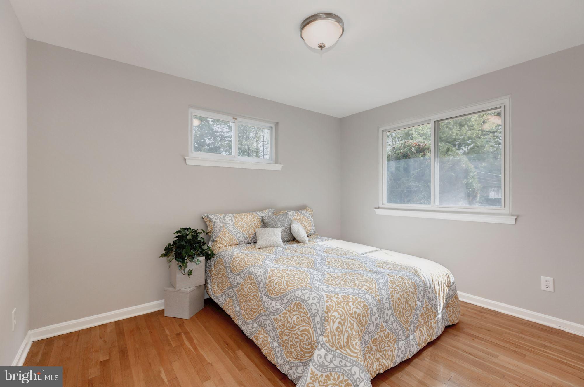 8425 Thames Street Springfield, VA 22151 - Photo 14 of 30 a bedroom with a bed and a window