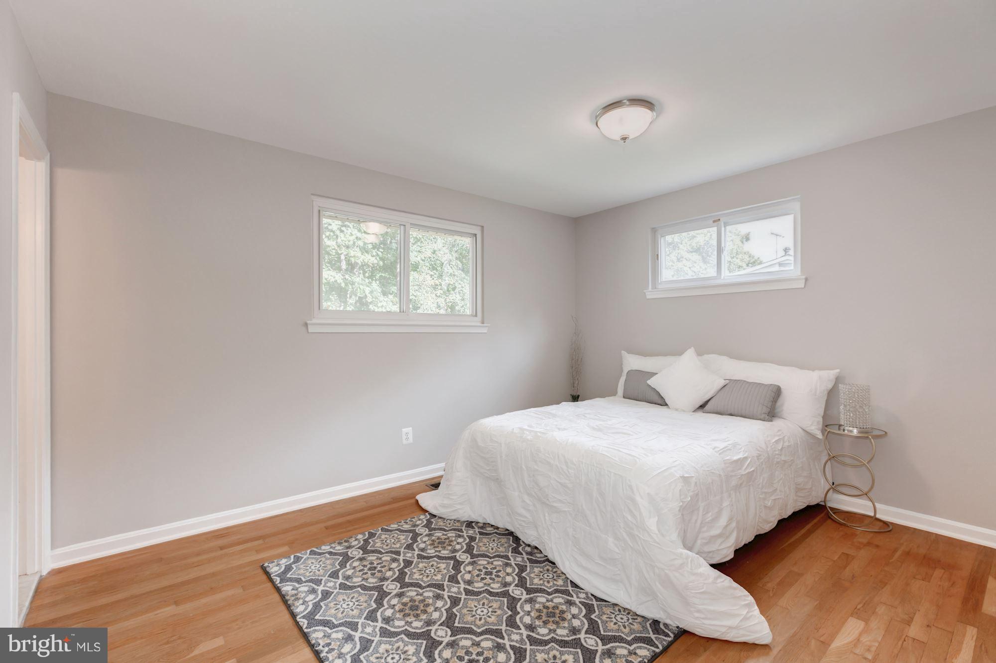 8425 Thames Street Springfield, VA 22151 - Photo 15 of 30 a bedroom with a bed and a window