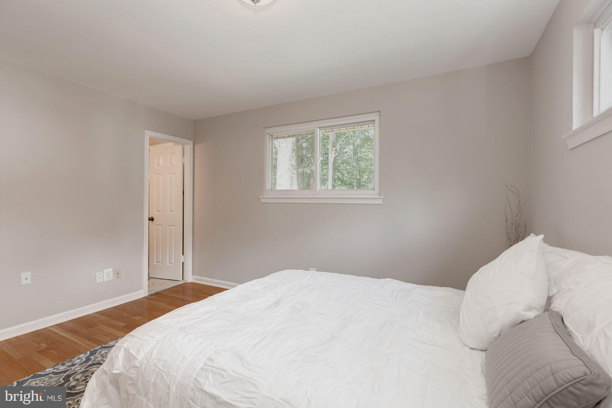 8425 Thames Street Springfield, VA 22151 - Photo 16 of 30 a bedroom with a bed and a window