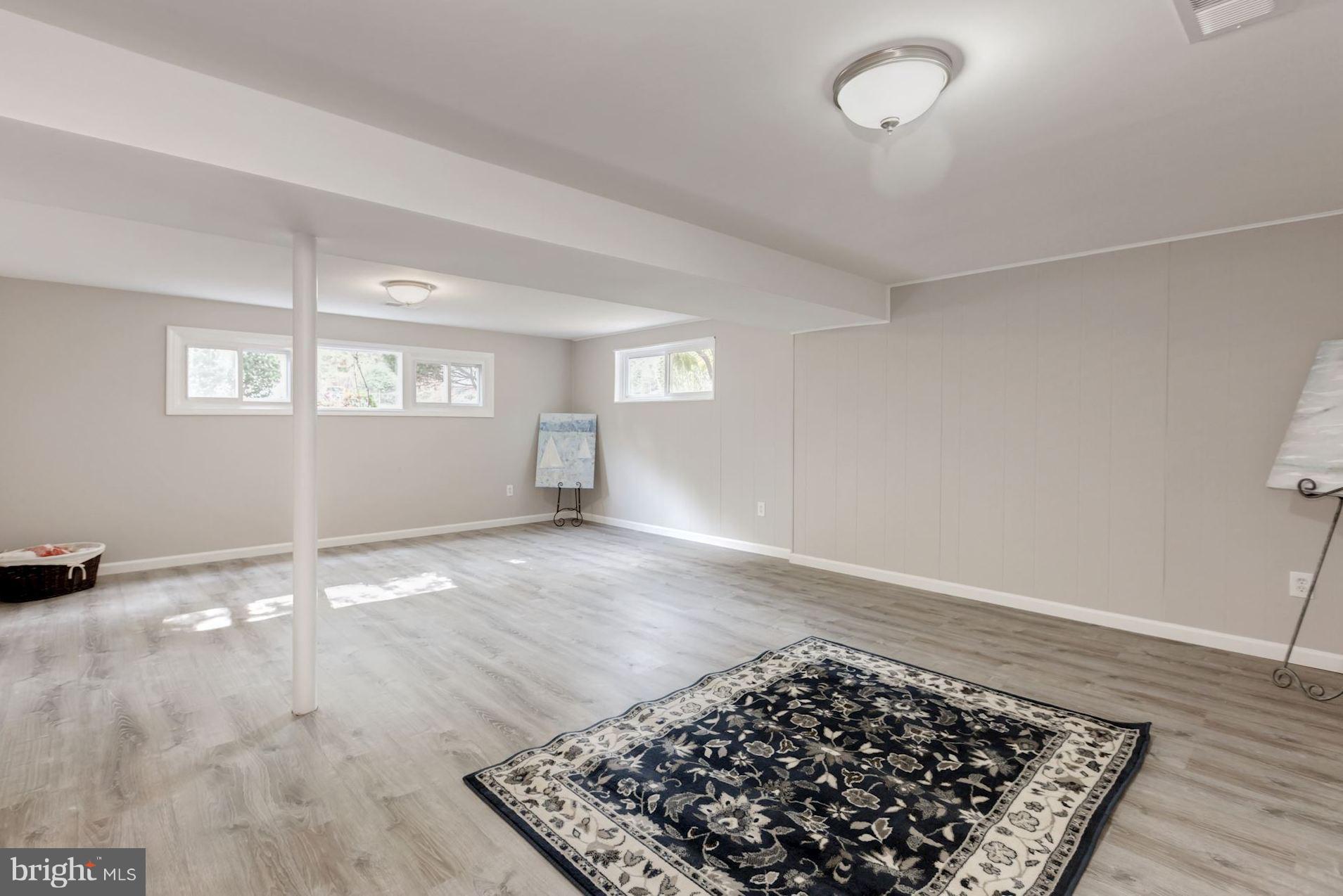 8425 Thames Street Springfield, VA 22151 - Photo 18 of 30 an empty room with wooden floor and window