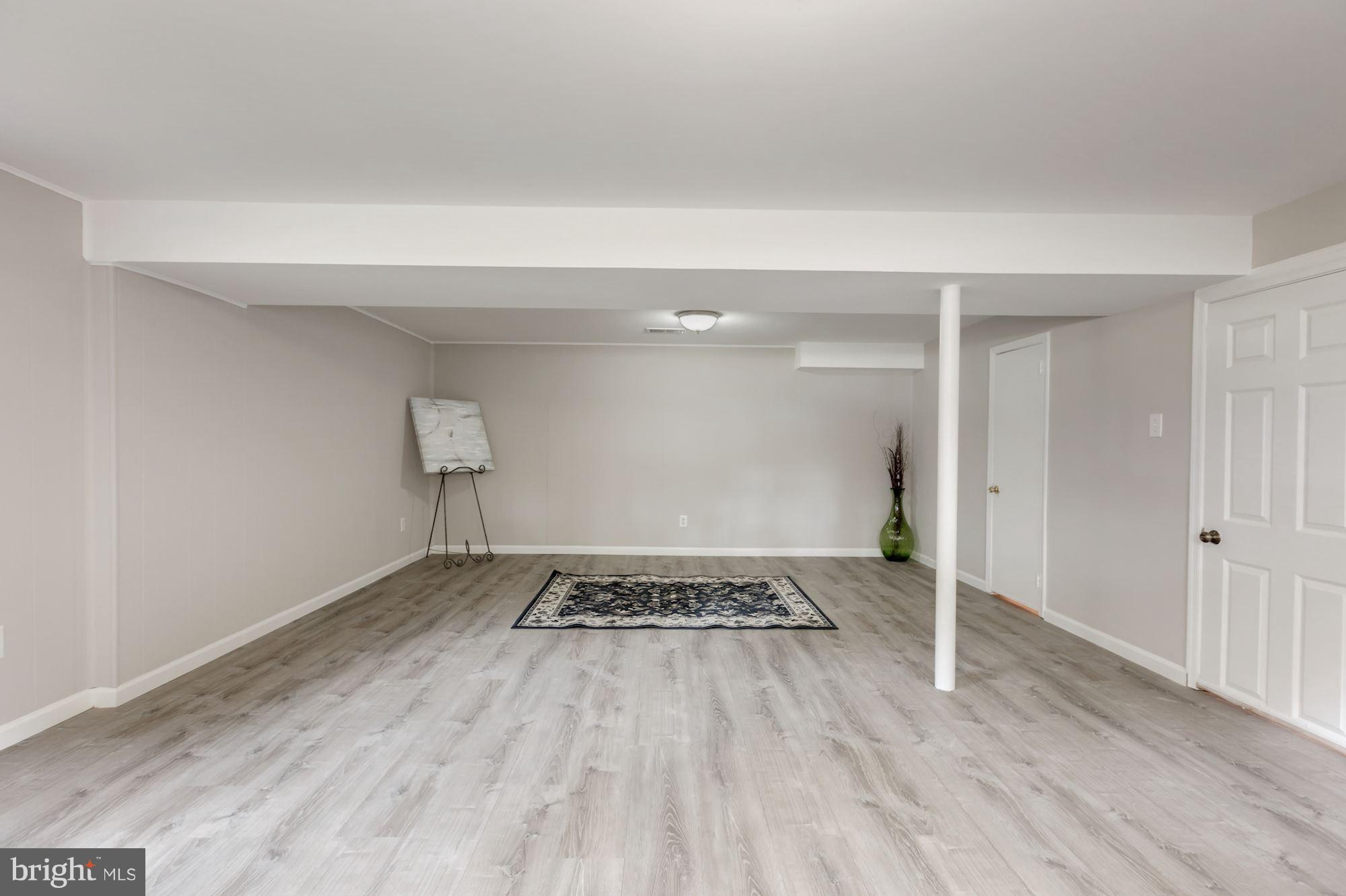 8425 Thames Street Springfield, VA 22151 - Photo 20 of 30 a view of an empty room and wooden floor