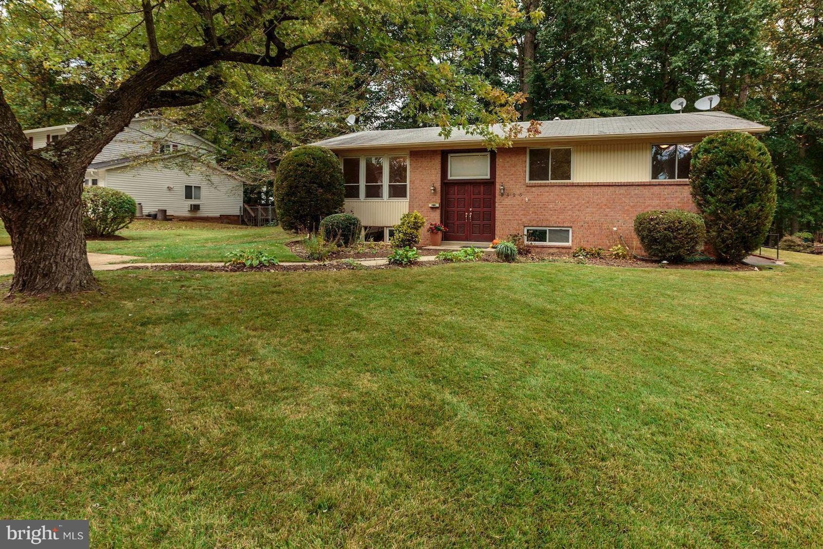 8425 Thames Street Springfield, VA 22151 - Photo 3 of 30 a front view of house with yard and green space