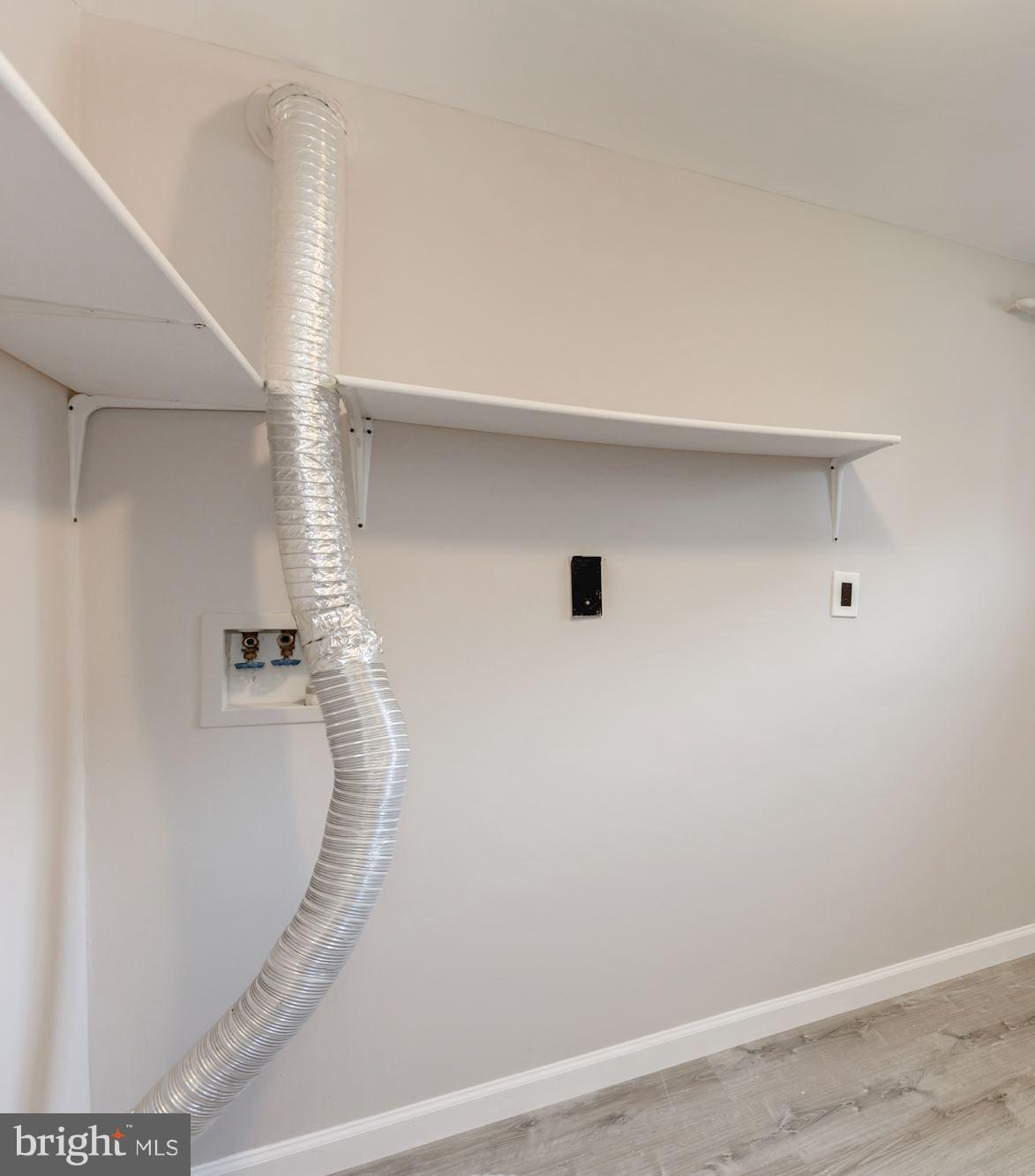8425 Thames Street Springfield, VA 22151 - Photo 24 of 30 a view of a room with racks on the wall