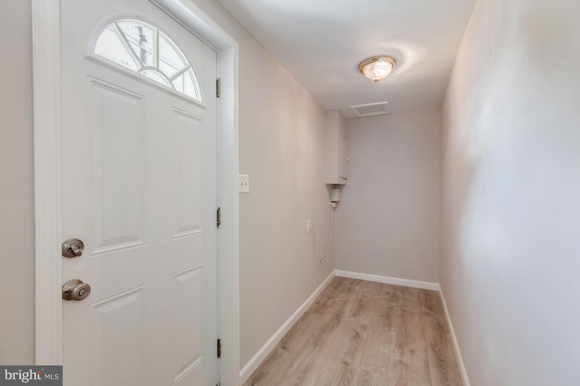 8425 Thames Street Springfield, VA 22151 - Photo 25 of 30 a view of a livingroom with wooden floor and a window
