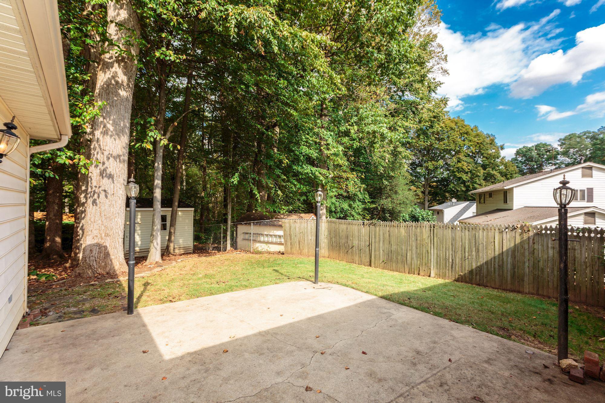 8425 Thames Street Springfield, VA 22151 - Photo 26 of 30 a view of a backyard with a tree