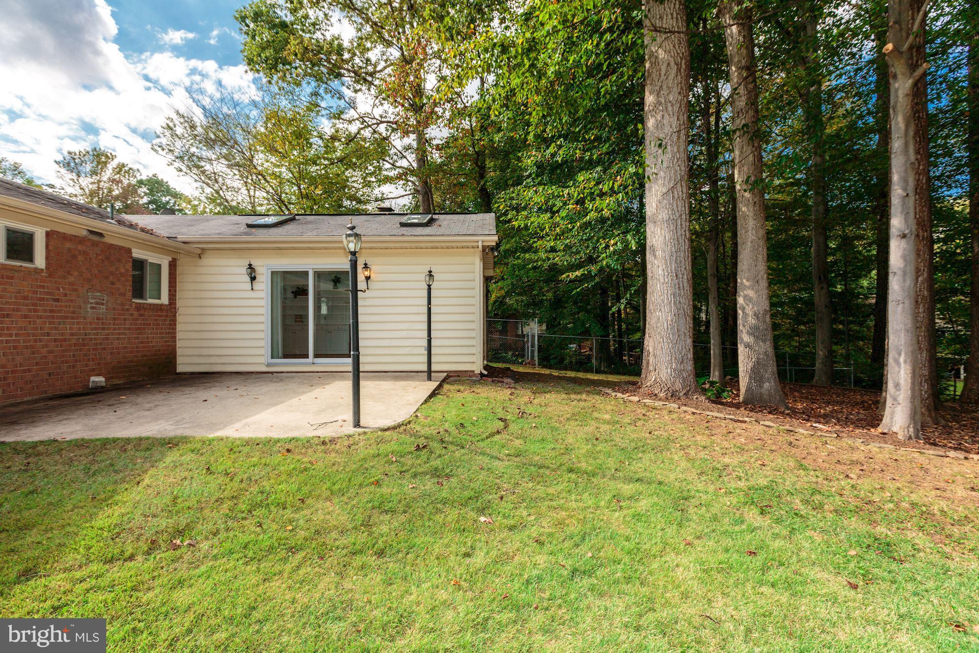 8425 Thames Street Springfield, VA 22151 - Photo 27 of 30 a house with trees in front of it