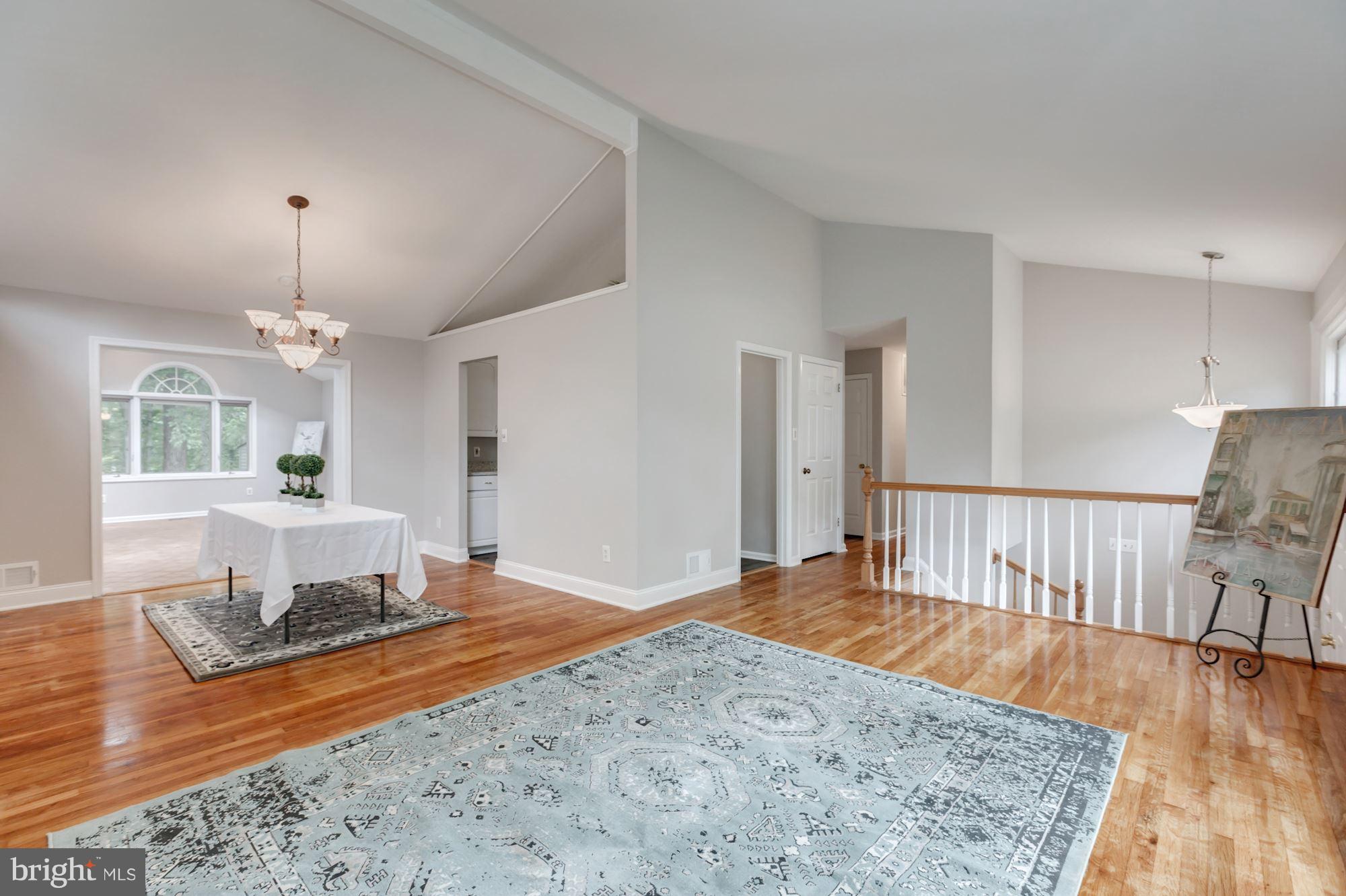 8425 Thames Street Springfield, VA 22151 - Photo 5 of 30 a living room with furniture and a wooden floor