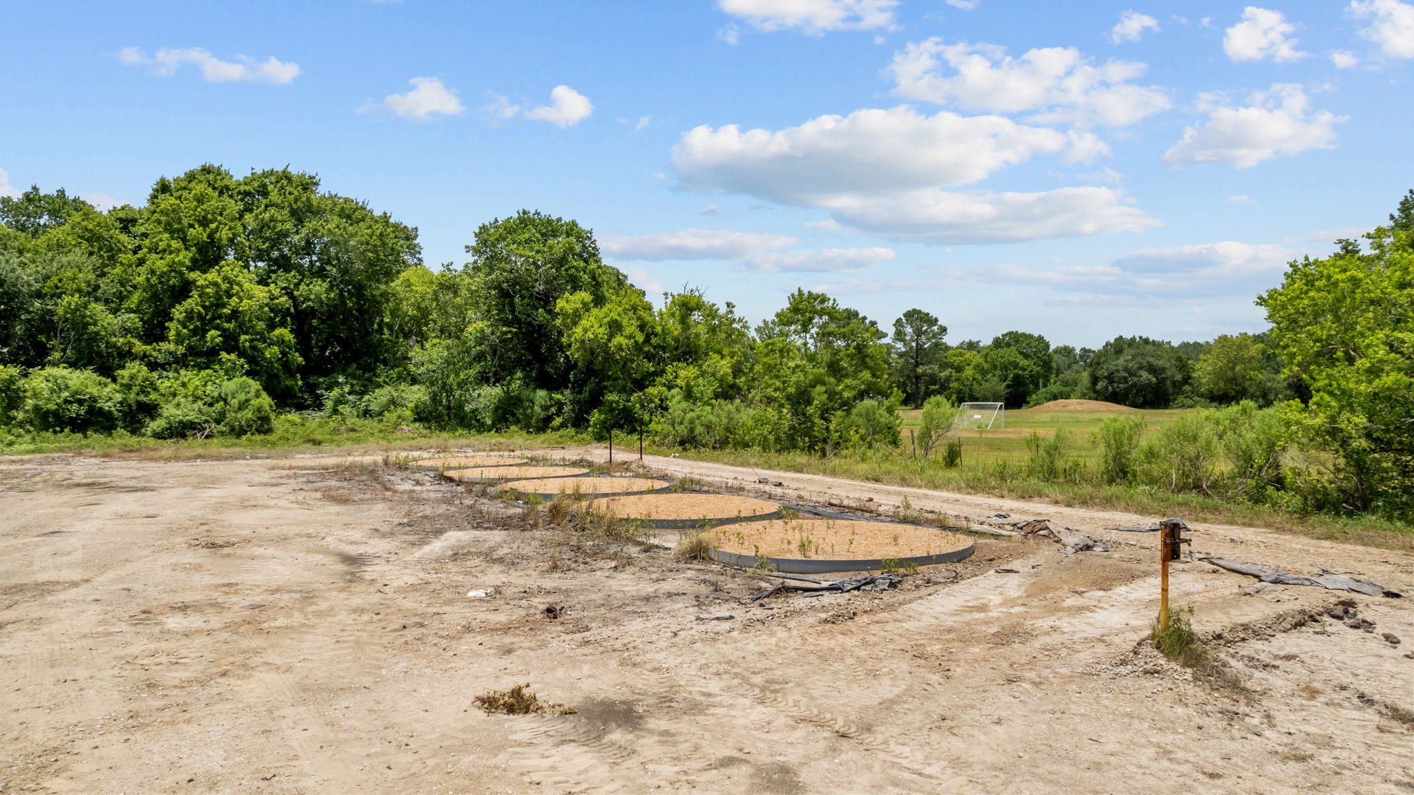 1403 Algoa-Friendswood Road Alvin, TX 77511 - Photo 14 of 21 a view of a dry yard with wooden fence