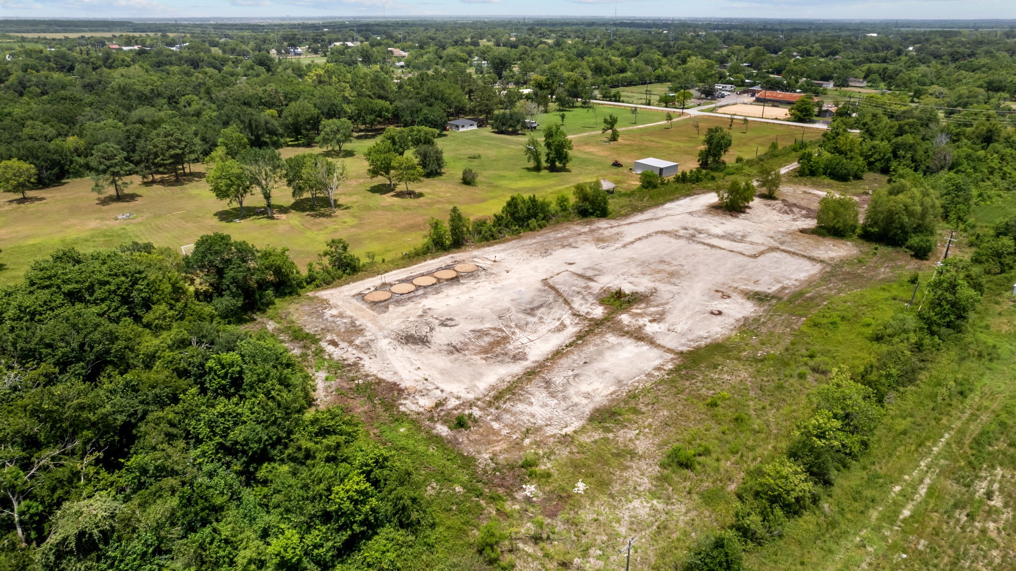 1403 Algoa-Friendswood Road Alvin, TX 77511 - Photo 2 of 21 an aerial view of residential houses with outdoor space and trees