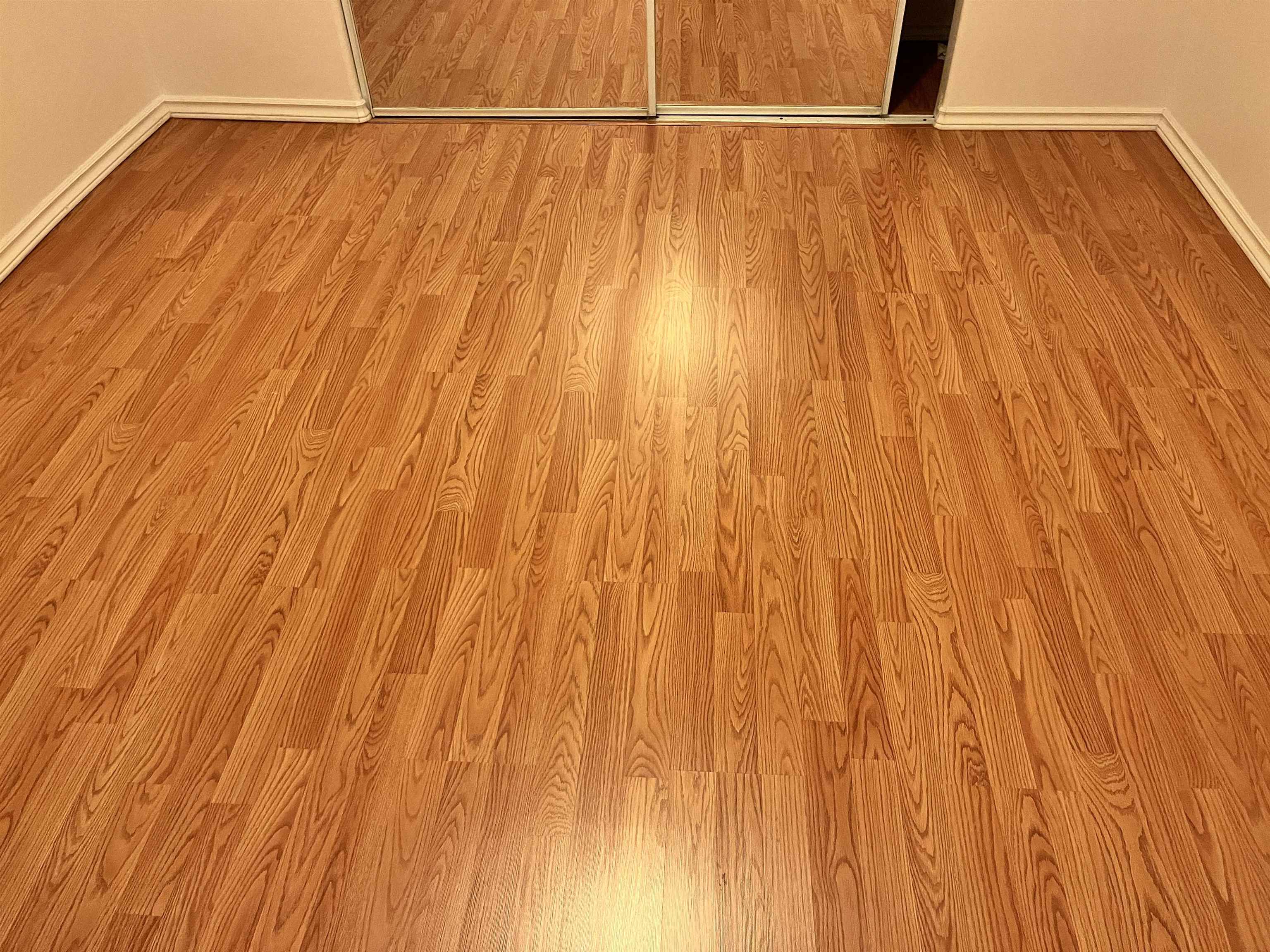 495 Liholiho Street, Unit 204 Wailuku, HI 96793 - Photo 15 of 42 a bathroom with a shower curtain and a wooden floor