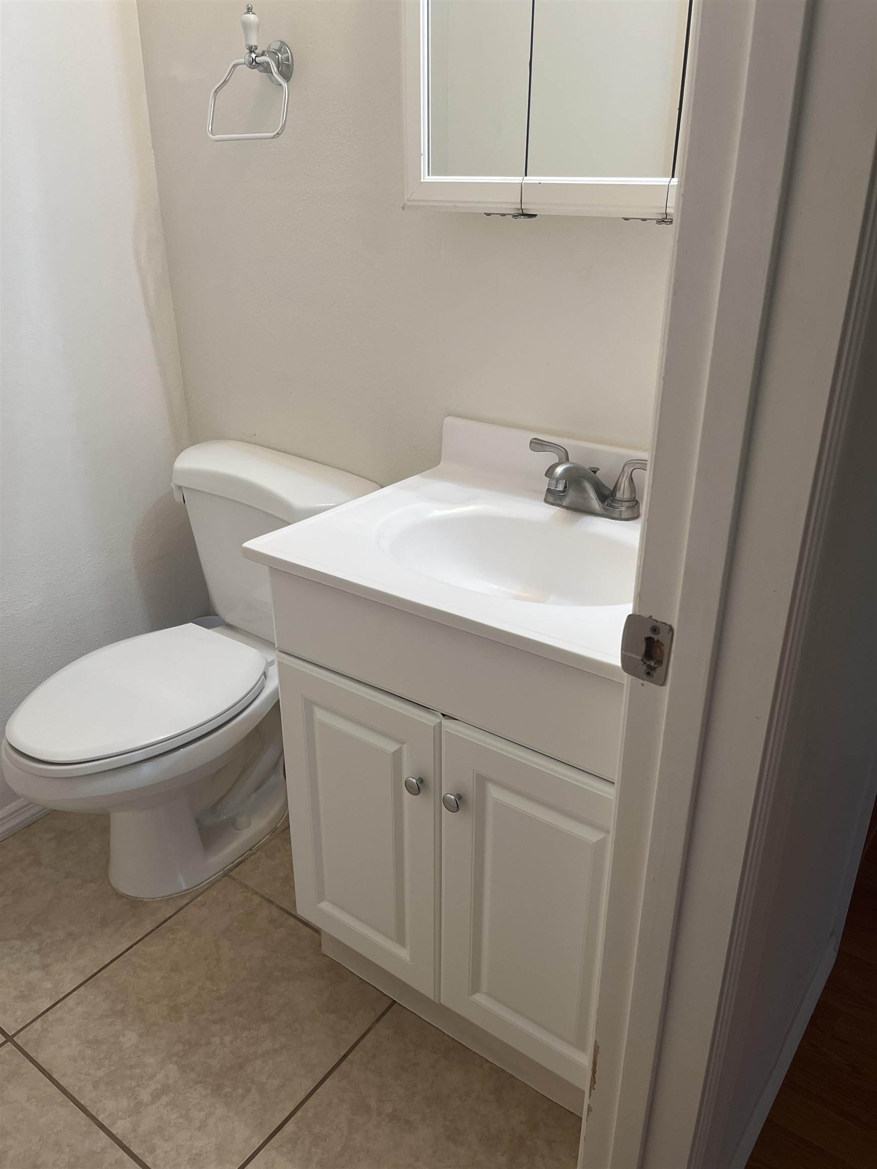 495 Liholiho Street, Unit 204 Wailuku, HI 96793 - Photo 23 of 42 a white toilet sitting next to a bathroom sink