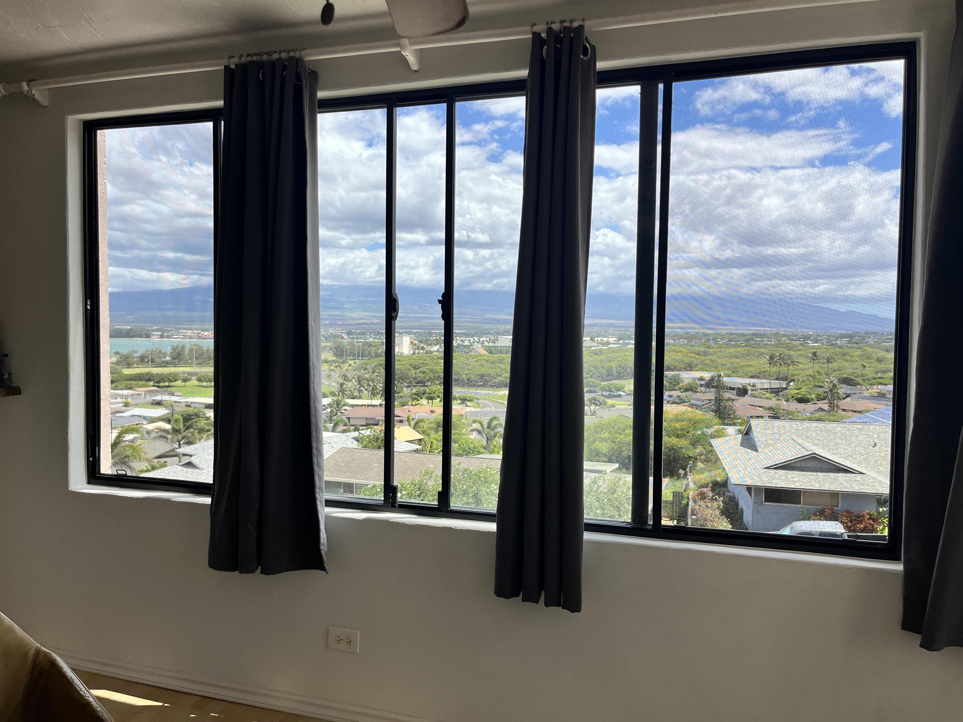 495 Liholiho Street, Unit 204 Wailuku, HI 96793 - Photo 8 of 42 a view of an empty room with a large window