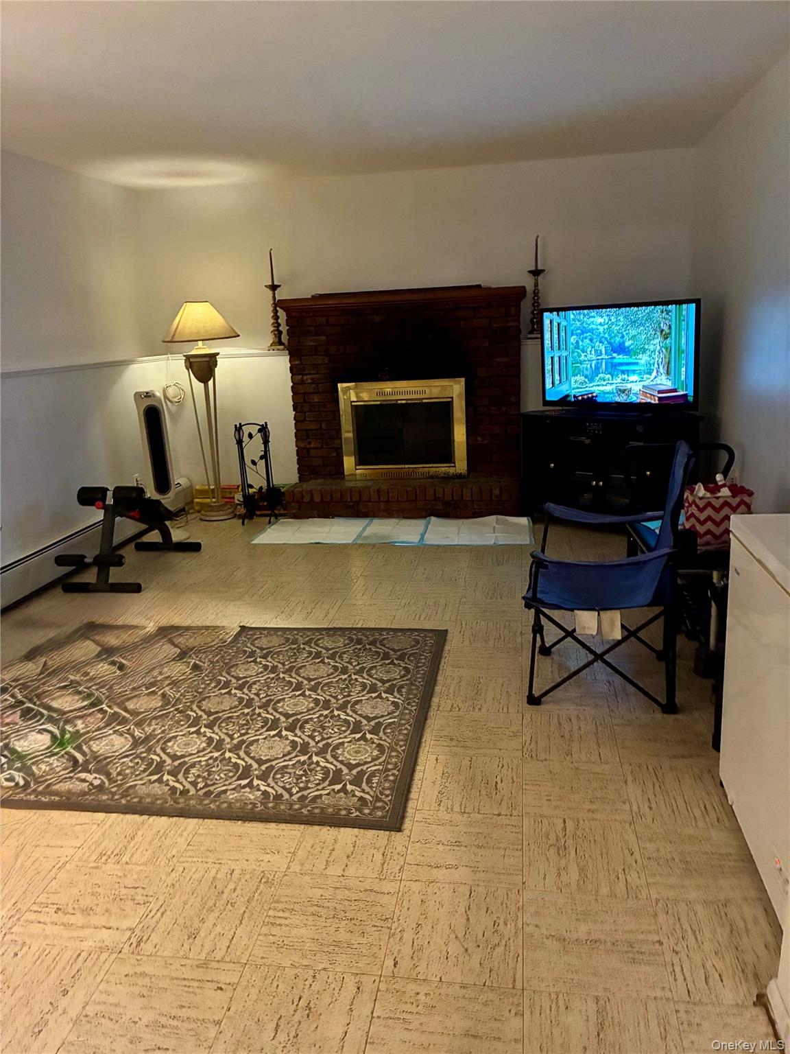 24 Ann Boulevard Spring Valley, NY 10977 - Photo 18 of 25 a living room with furniture and a flat screen tv