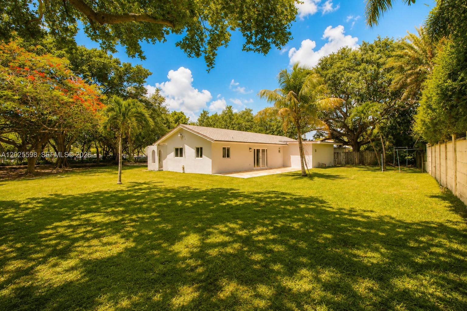 9421 Southwest 150th Street Miami, FL 33176 - Photo 31 of 31 a house view with swimming pool in front of it
