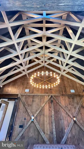 a bathroom with a sink mirror and shower