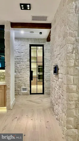 a view of front door of house with outdoor seating