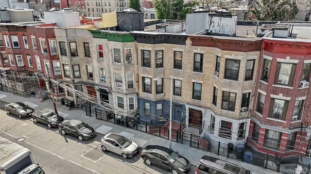 a front view of a building with parking space