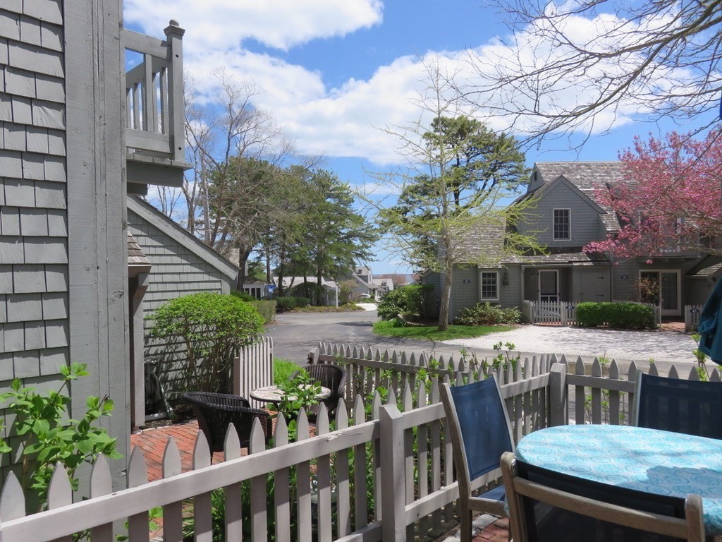 40 Brant Rock Road, Unit 40 Mashpee, MA 02649 - Photo 2 of 16 a view of a patio with furniture