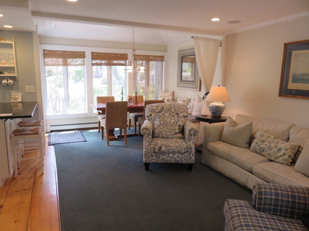 40 Brant Rock Road, Unit 40 Mashpee, MA 02649 - Photo 3 of 16 a living room with furniture and a large window
