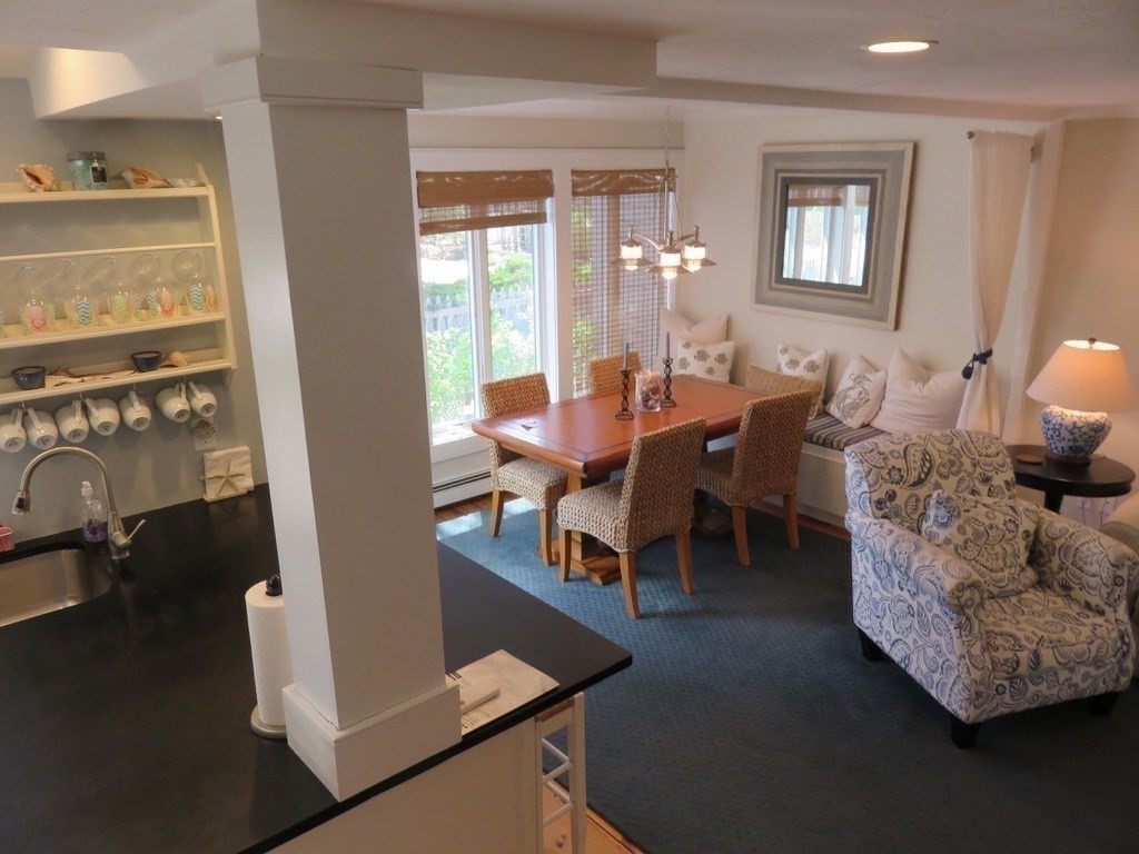 40 Brant Rock Road, Unit 40 Mashpee, MA 02649 - Photo 4 of 16 a living room with furniture and a window