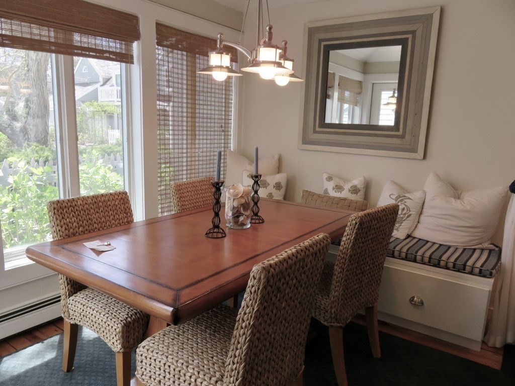 40 Brant Rock Road, Unit 40 Mashpee, MA 02649 - Photo 5 of 16 a view of a dining room with furniture