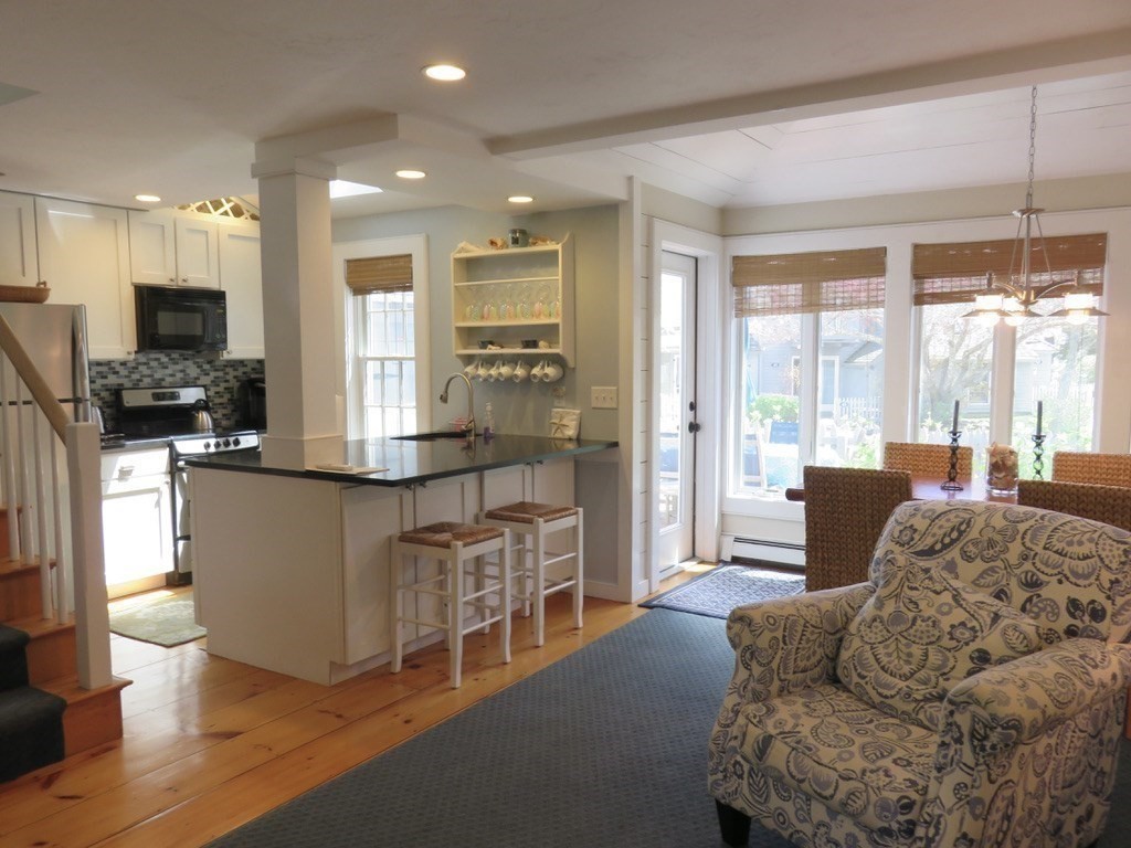 40 Brant Rock Road, Unit 40 Mashpee, MA 02649 - Photo 7 of 16 a living room with furniture and a flat screen tv
