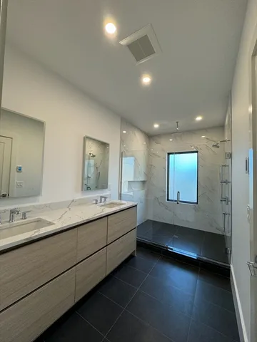 a view of bathroom with dual sinks