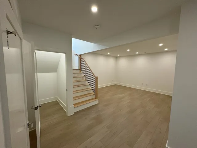 a view of an empty room with stairs