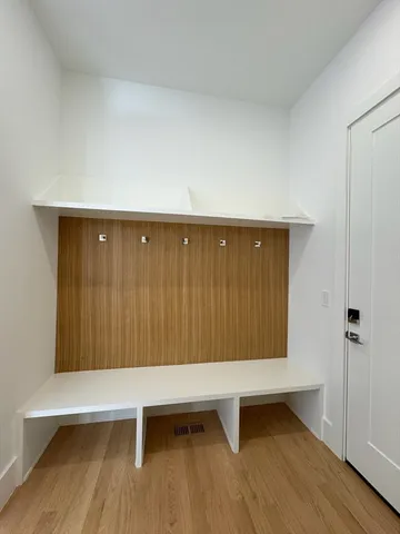 a view of entryway with wooden floor