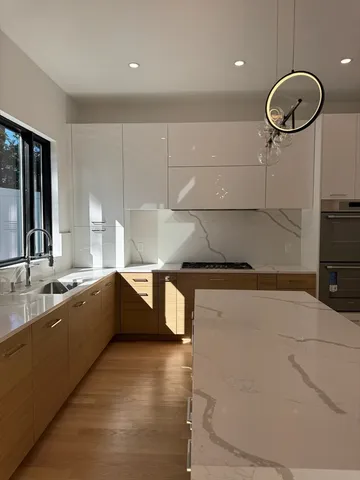 a large kitchen with a large counter space