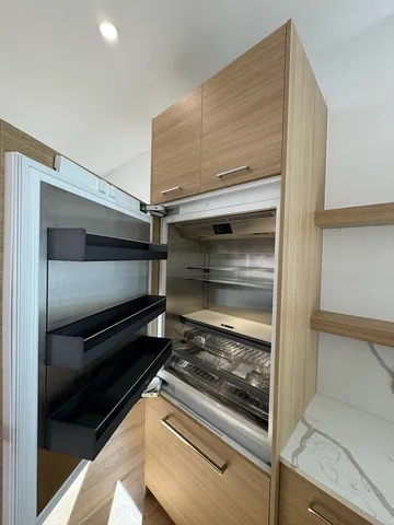 a refrigerator in kitchen counter