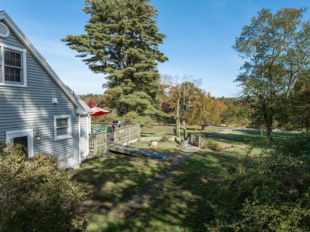 66 Chapin Road Hampden, MA 01036 - Photo 22 of 31 a backyard of a house with lots of green space