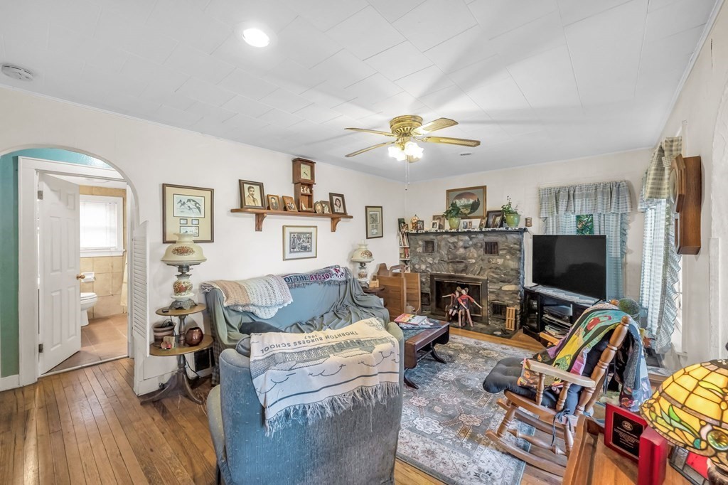 66 Chapin Road Hampden, MA 01036 - Photo 5 of 31 a living room with furniture a fireplace and a flat screen tv
