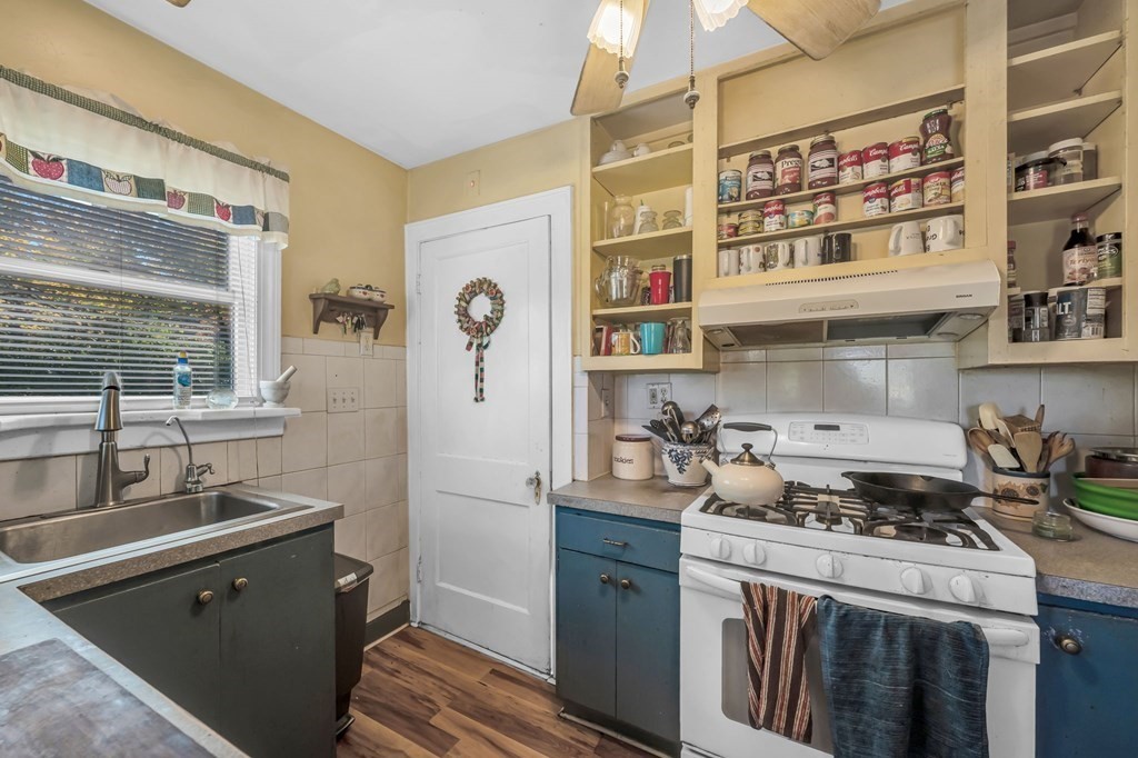 66 Chapin Road Hampden, MA 01036 - Photo 10 of 31 a kitchen with a sink stove and cabinets