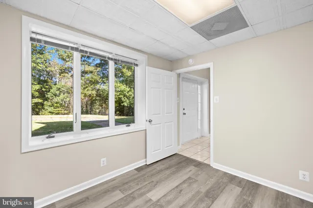 a view of an empty room with a window