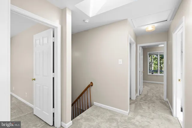 a view of a hallway with two rooms