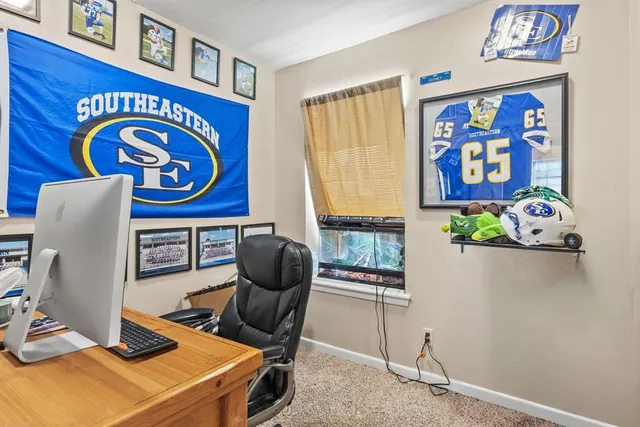 a room with furniture and painting on the wall