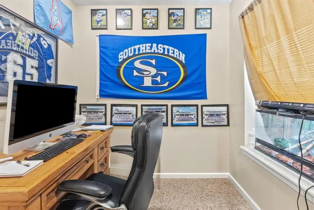 a view of a workspace with furniture