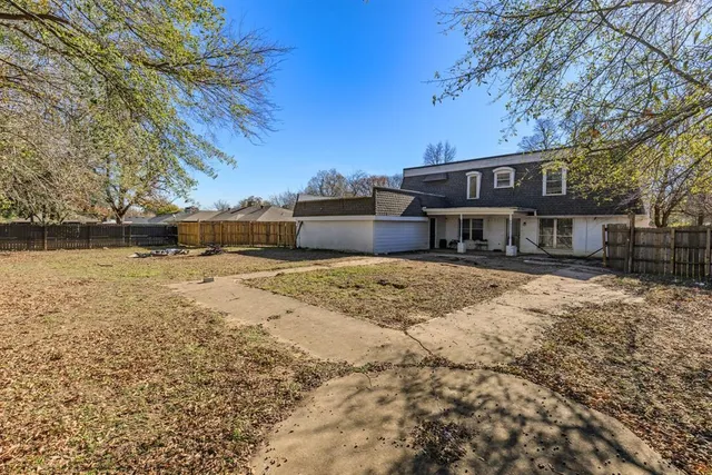 a view of a house with a snow on the road