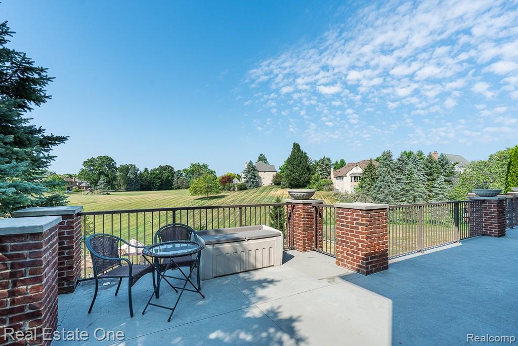 5575 Murfield Drive Rochester, MI 48306 - Photo 47 of 53 Loggia space with doors from Library