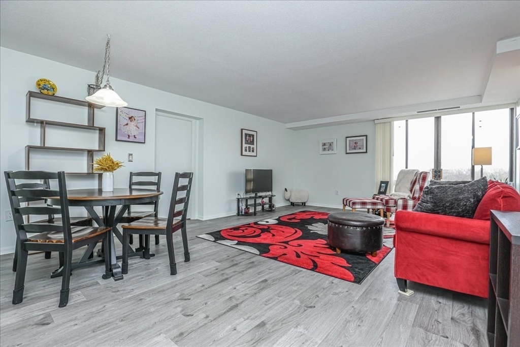 402 Paradise Road, Unit PHJ Swampscott, MA 01907 - Photo 4 of 27 a living room with furniture and wooden floor