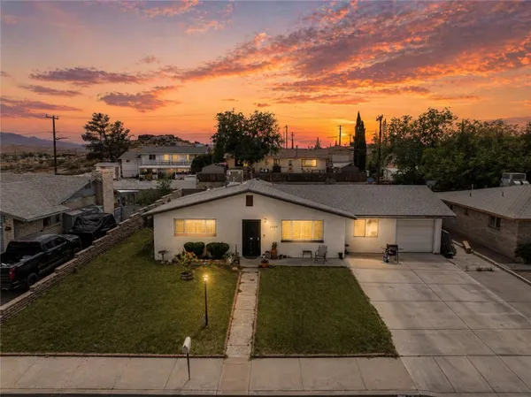 a aerial view of a house with a yard
