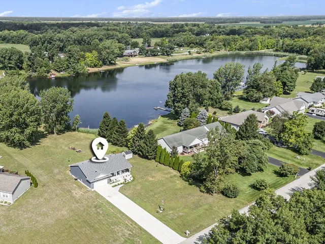 an aerial view of a house with outdoor space