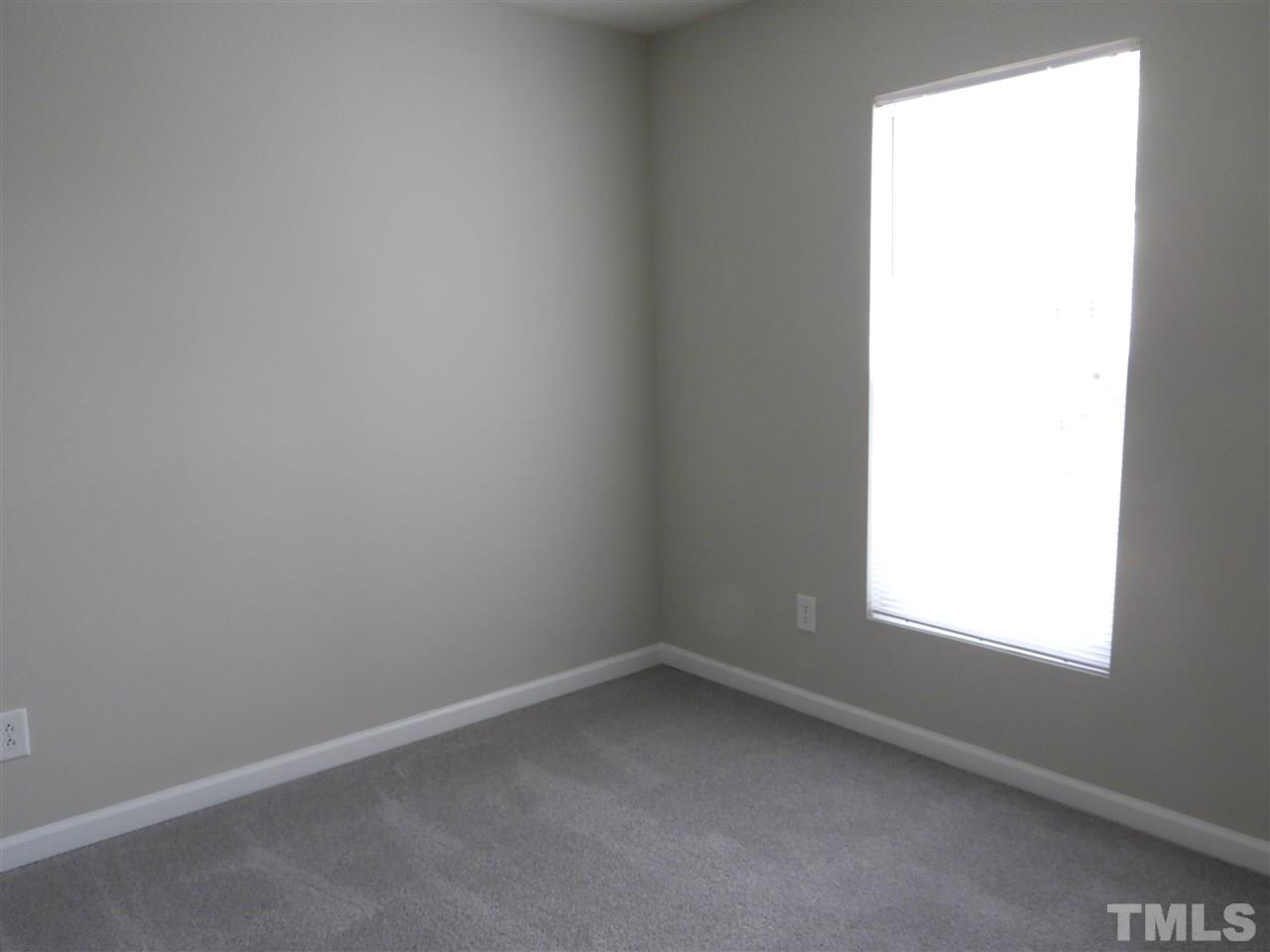7245 Racine Way Raleigh, NC 27690 - Photo 16 of 29 an empty room with a window
