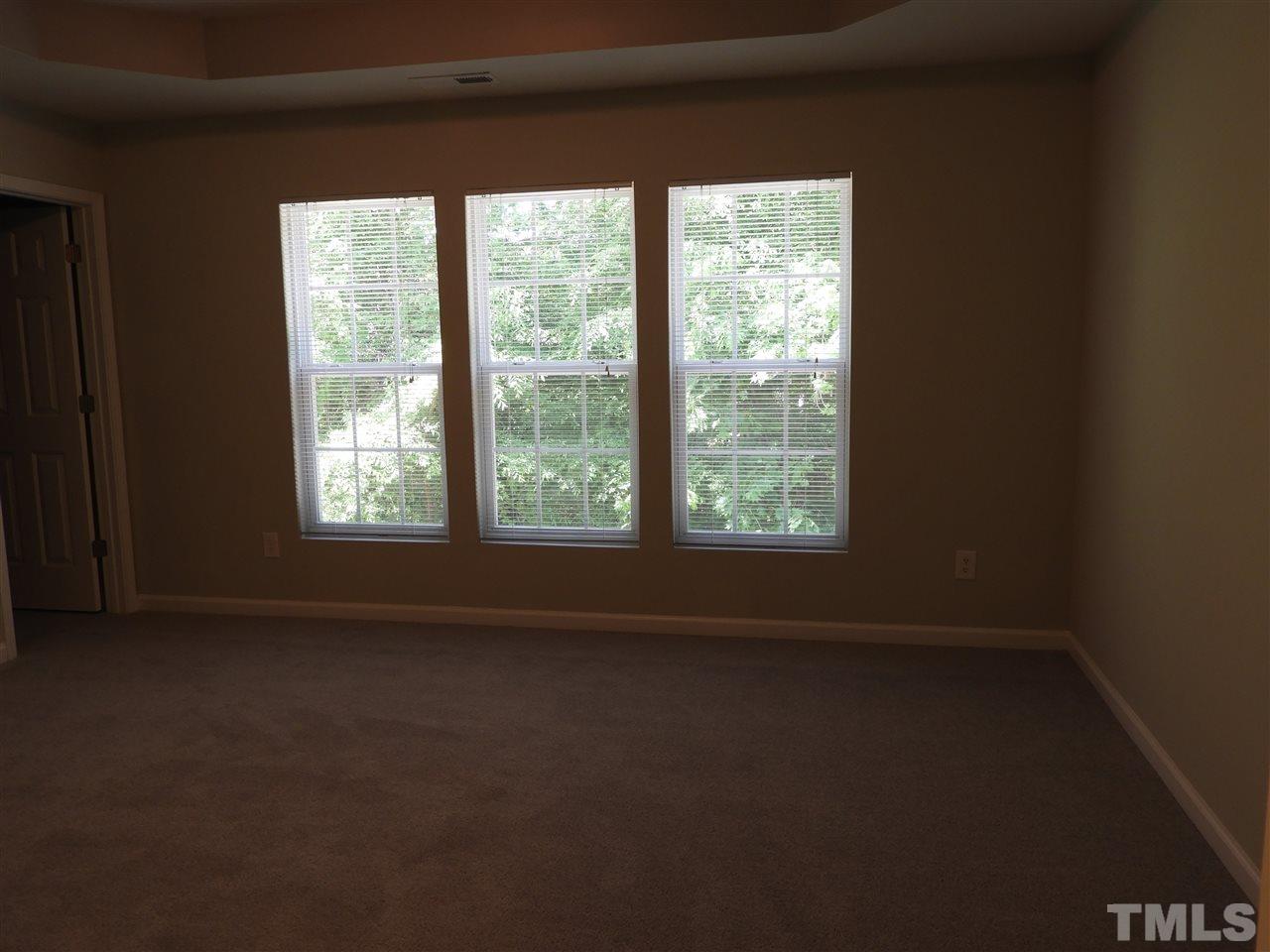 7245 Racine Way Raleigh, NC 27690 - Photo 22 of 29 a view of a room that has a window in it